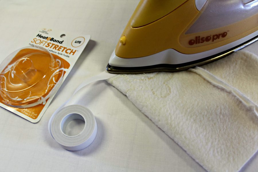 applying heatnbond soft stretch hem tape with oliso pro iron