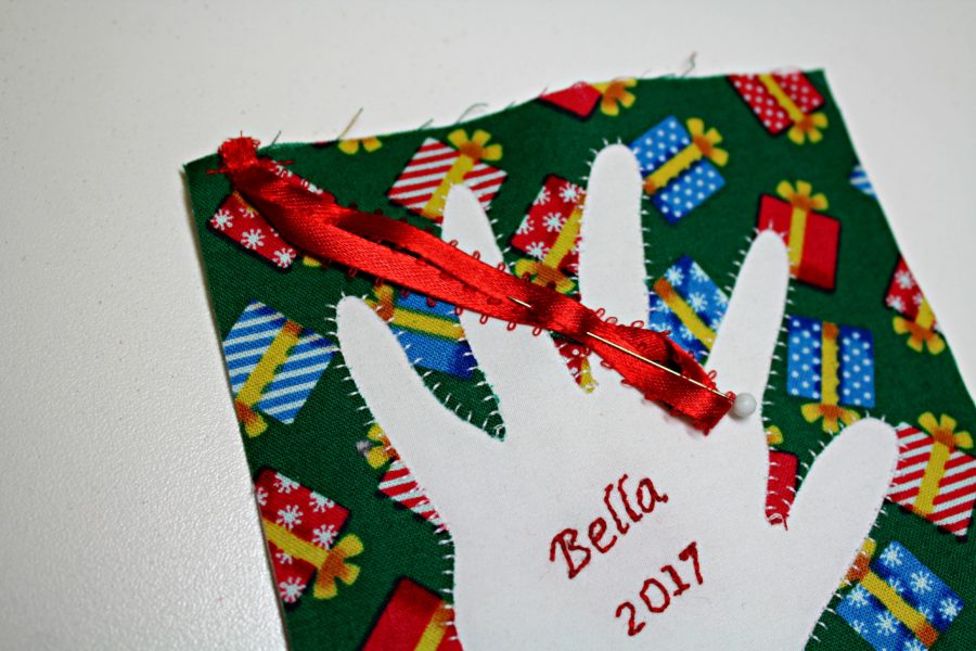 Ribbon placement for handprint reverse appliqued ornament by carla at creatin' in the sticks