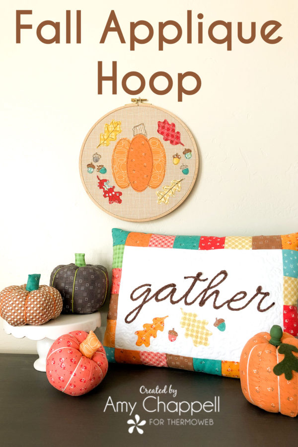 Fall hoop with pumpkin and leaves made using raw edge applique.