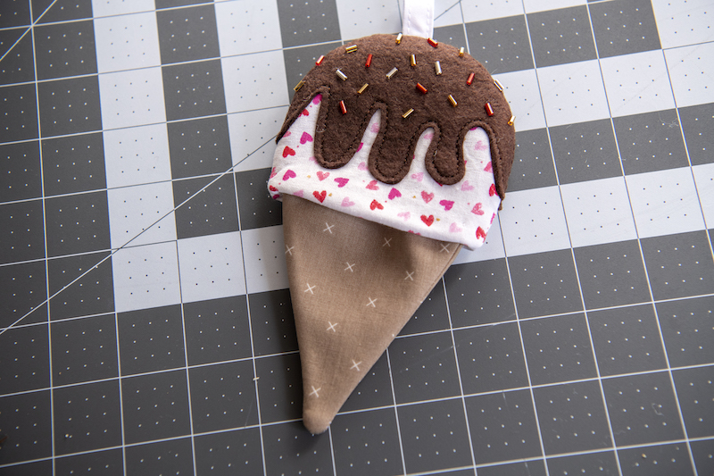 attach cones to ice cream tops