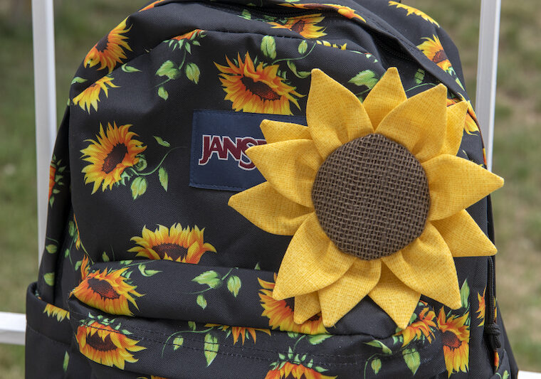 sewn sunflower on backpack