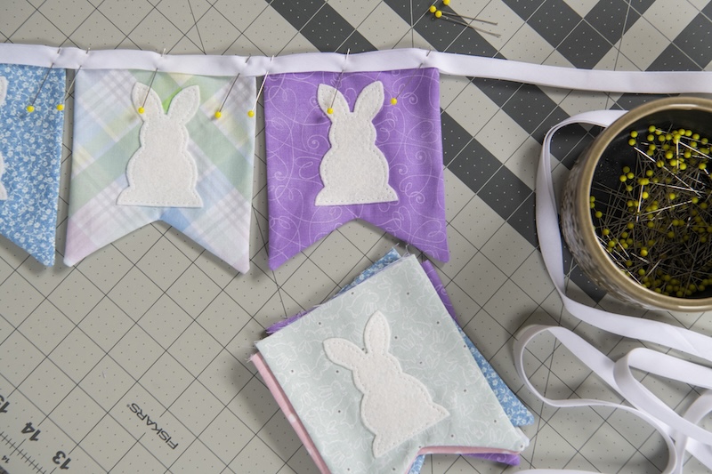 place flags into bias tape and sew