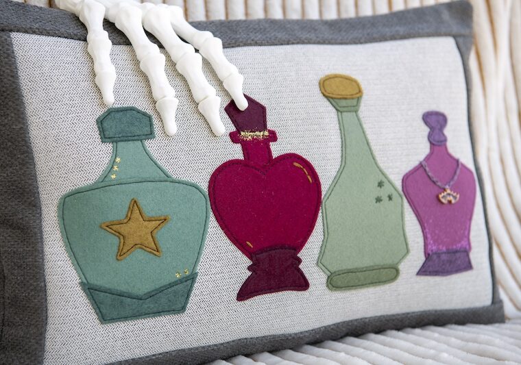 pillow with potion bottle applique